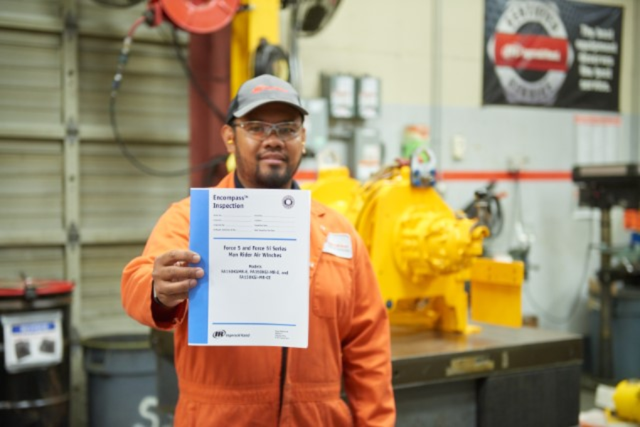 Man holding inspection document